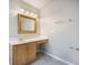 Well-lit bathroom featuring a vanity, mirror, and tile flooring at 5406 Woodbreeze Dr, North Charleston, SC 29420