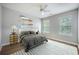 Bright bedroom featuring ample natural light, ceiling fan, and neutral décor at 5406 Woodbreeze Dr, North Charleston, SC 29420