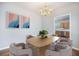 Well lit dining area with a view of an open kitchen, creating a warm and inviting space at 5406 Woodbreeze Dr, North Charleston, SC 29420