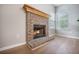 Classic brick fireplace with decorative mantle and hearth adds warmth and charm to the living area at 5406 Woodbreeze Dr, North Charleston, SC 29420