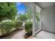 Charming front porch with brick accents and a view of the landscaped front yard at 5406 Woodbreeze Dr, North Charleston, SC 29420