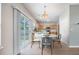 Bright eat-in kitchen with access to the outdoors and a contemporary design at 5406 Woodbreeze Dr, North Charleston, SC 29420