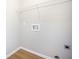 Empty laundry room showing a shelf and utility connections at 5406 Woodbreeze Dr, North Charleston, SC 29420