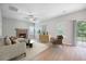 Inviting living room features a brick fireplace, neutral color palette and sliding doors to a backyard view at 5406 Woodbreeze Dr, North Charleston, SC 29420