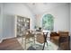 Bright office space with a large arched window and a modern desk, chair and shelving unit at 5406 Woodbreeze Dr, North Charleston, SC 29420