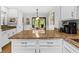 Bright kitchen area with white cabinets, granite countertops, and modern appliances at 55 Fairway Dunes Ln # Week 2, Isle of Palms, SC 29451