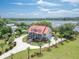 Picturesque aerial view showcasing home's river access and manicured grounds and landscaping at 5625 Crystal Harbor Ln, Hollywood, SC 29449
