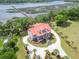 Majestic home with wrap around porch and dock on the river surrounded by lush nature at 5625 Crystal Harbor Ln, Hollywood, SC 29449