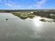 Panoramic aerial view of marsh with pier and gazebo leading to a beautiful low country home on the river at 5625 Crystal Harbor Ln, Hollywood, SC 29449