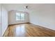 Cozy bedroom featuring hardwood floors, ample natural light, and a ceiling fan at 5625 Crystal Harbor Ln, Hollywood, SC 29449