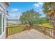 Charming wooden deck overlooking a scenic view, perfect for enjoying the outdoors and relaxing at 5625 Crystal Harbor Ln, Hollywood, SC 29449