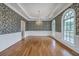 Elegant dining room featuring hardwood floors, arched windows, and a decorative chandelier at 5625 Crystal Harbor Ln, Hollywood, SC 29449