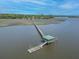 Scenic view from the river showcases a dock that leads to a gazebo and boat lift at 5625 Crystal Harbor Ln, Hollywood, SC 29449