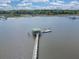 Aerial view showcases dock on calm water, perfect for boating and relaxing by the river at 5625 Crystal Harbor Ln, Hollywood, SC 29449