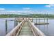 Dock with a gazebo overlooking peaceful water on a sunny day at 5625 Crystal Harbor Ln, Hollywood, SC 29449
