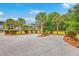 Long driveway leading to picturesque homes surrounded by lush landscaping and trees at 5625 Crystal Harbor Ln, Hollywood, SC 29449