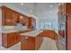 Elegant kitchen featuring custom wood cabinets, marble countertops, stainless appliances and island with pendant lighting at 5625 Crystal Harbor Ln, Hollywood, SC 29449