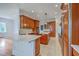 Spacious kitchen boasting an island, tile floors, custom cabinets, and stainless appliances at 5625 Crystal Harbor Ln, Hollywood, SC 29449