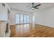 Spacious living room boasts a cozy fireplace and sliding glass doors with backyard views at 5625 Crystal Harbor Ln, Hollywood, SC 29449