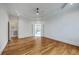 Spacious main bedroom with hardwood floors, tray ceilings and a view into the en suite bathroom at 5625 Crystal Harbor Ln, Hollywood, SC 29449