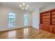 Office space offering hardwood floors, custom built-in shelves, and a large window for natural light at 5625 Crystal Harbor Ln, Hollywood, SC 29449