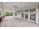 Spacious covered porch featuring multiple entry doors and classic ceiling fans for comfortable outdoor living at 5625 Crystal Harbor Ln, Hollywood, SC 29449