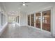 Spacious sunroom featuring a tile floor and a wall of windows providing natural light and scenic views at 5625 Crystal Harbor Ln, Hollywood, SC 29449