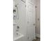 Updated shower with white subway tile, modern fixtures, and a convenient built-in shelf at 672 W Oak Forest Dr, Charleston, SC 29407