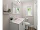 Bright bathroom featuring a modern vanity, updated fixtures, and a window for natural light at 672 W Oak Forest Dr, Charleston, SC 29407