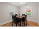 Formal dining room with hardwood floors and square table with leather chairs at 672 W Oak Forest Dr, Charleston, SC 29407