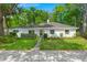 The front exterior features lush landscaping and a well-maintained lawn enhancing curb appeal at 672 W Oak Forest Dr, Charleston, SC 29407