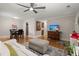 The living room blends with the dining area, showcasing hardwood floors and a modern ceiling fan at 672 W Oak Forest Dr, Charleston, SC 29407