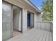 Exterior balcony view with sliding doors leading to carpeted rooms on either side at 807 Greencastle Dr, Goose Creek, SC 29445