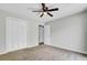 Bedroom featuring plush carpet, a modern ceiling fan, and a closet with white paneled doors at 807 Greencastle Dr, Goose Creek, SC 29445