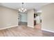Spacious dining area with hardwood floors, light fixtures, and open-concept design at 807 Greencastle Dr, Goose Creek, SC 29445