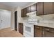 Updated kitchen features a white range, dark cabinetry, and tile flooring at 807 Greencastle Dr, Goose Creek, SC 29445