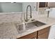 Close-up of the kitchen sink with stainless steel fixtures and tile backsplash at 807 Greencastle Dr, Goose Creek, SC 29445