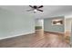 Bright living room featuring wood floors, neutral wall colors, and modern ceiling fan at 807 Greencastle Dr, Goose Creek, SC 29445