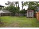 Spacious backyard with a storage shed, wooden fence, and lush green lawn at 814 Armsway St, Mount Pleasant, SC 29464