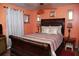 A bedroom featuring a sizable bed with matching dressers and warm decor at 814 Armsway St, Mount Pleasant, SC 29464