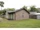 Side view of a home featuring brick and wood siding with a well-maintained lawn at 814 Armsway St, Mount Pleasant, SC 29464