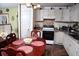 Functional kitchen with white cabinetry and adjacent dining area at 814 Armsway St, Mount Pleasant, SC 29464