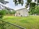 Exterior view of home highlighting the backyard with a fence, appliances and a propane tank at 9489 Sidneys Rd, Round O, SC 29474