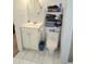 Bathroom with sink, toilet, and shelving unit at 9489 Sidneys Rd, Round O, SC 29474
