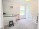 Bedroom with carpeted floors, a window, and white walls at 9489 Sidneys Rd, Round O, SC 29474