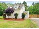 Charming two-story home with manicured landscaping, including decorative mulch and well-kept shrubs at 9489 Sidneys Rd, Round O, SC 29474