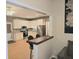 Open kitchen features granite countertops, stainless steel appliances, and a breakfast bar at 9489 Sidneys Rd, Round O, SC 29474