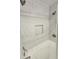 Shower with tiled walls, niche, and shower head at 9489 Sidneys Rd, Round O, SC 29474