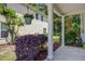 Cozy backyard with columned patio, landscaped garden, and lush greenery at 9624 Scarborough Ct, Summerville, SC 29485