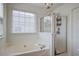 Relaxing bathroom with a large soaking tub and a glass-enclosed shower at 9624 Scarborough Ct, Summerville, SC 29485